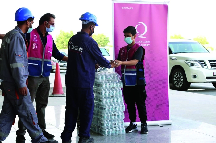 Qatar Charity joins together with a local effort to provide employees with water.