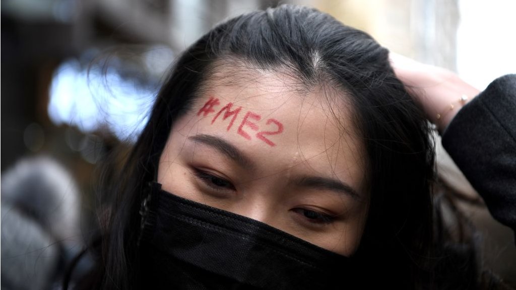 Girl with #MeToo written on her forehead