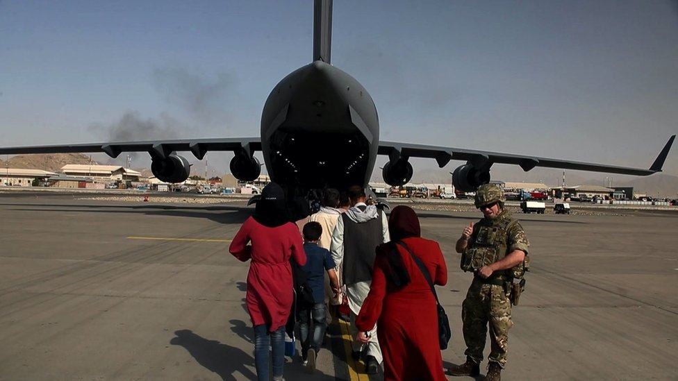 family leaving Afghanistan