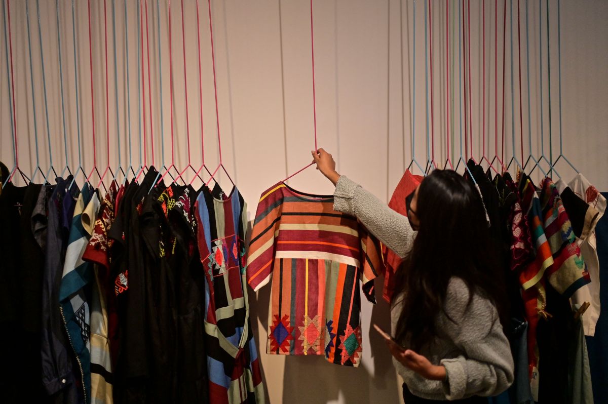 A woman works in a clothing store made with fabrics created in the company's indigenous Mexican communities "Social Factory".