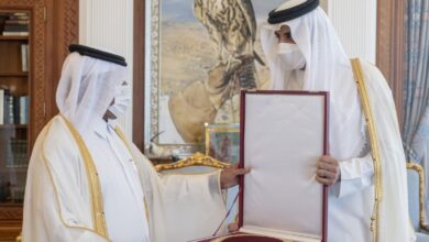 H E Sheikh Abdulla bin Saoud Al Thani receives the Hamad bin Khalifa sash from H H the Amir